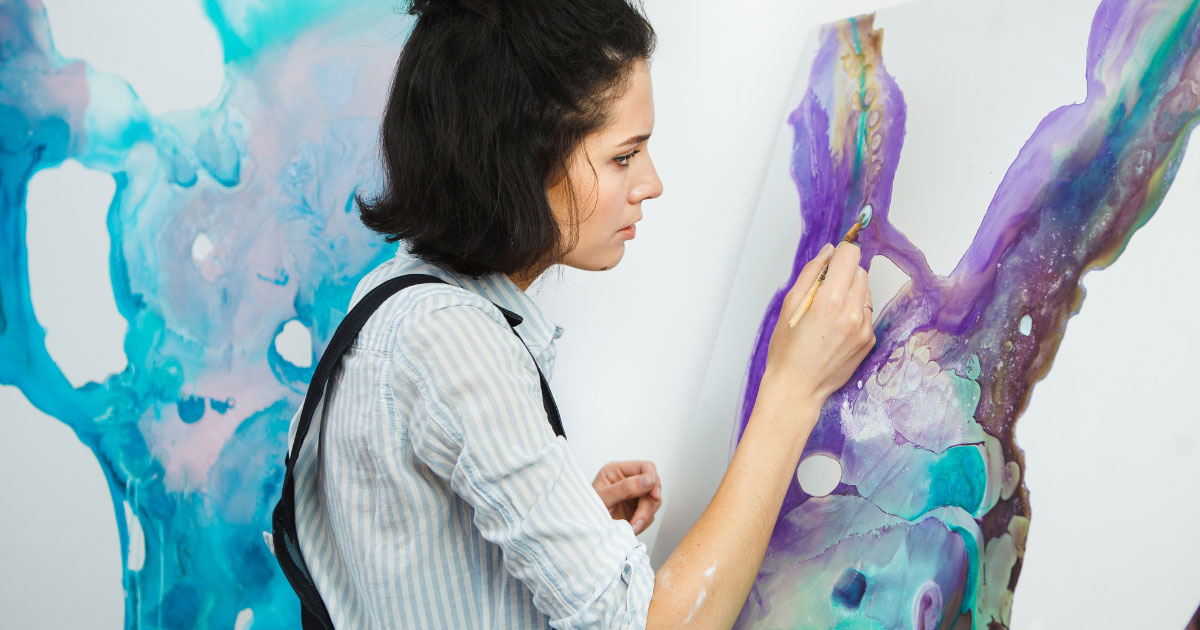 Artist painting to keep her mind busy